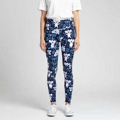 Person wearing navy blue leggings with white koala bear print on a light grey background