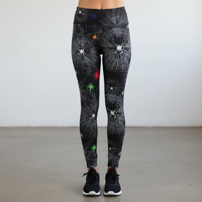 Leggings with spider web and spider design on a plain background